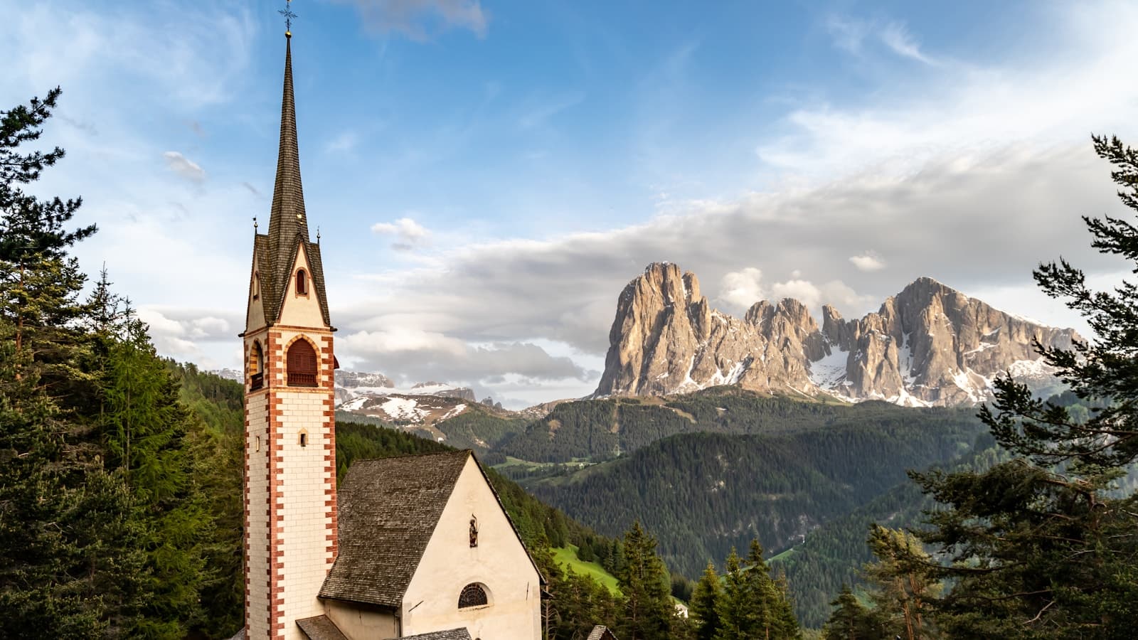 Pale limestone peaks of the Dolomites above Alta Badia at dusk.